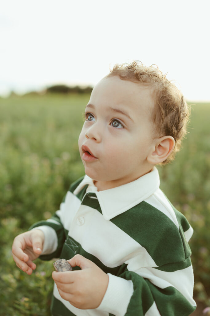 Mom holding her toddler during a golden hour family photography session in Queen Creek, AZ