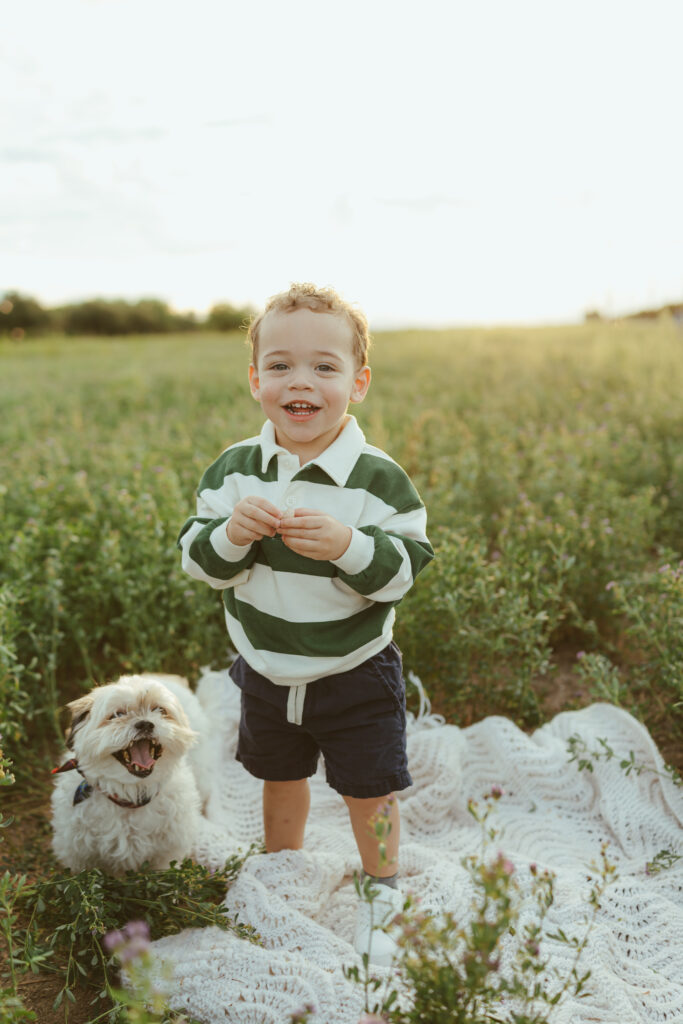 Toddler exploring an open field during family photography in Queen Creek, Arizona